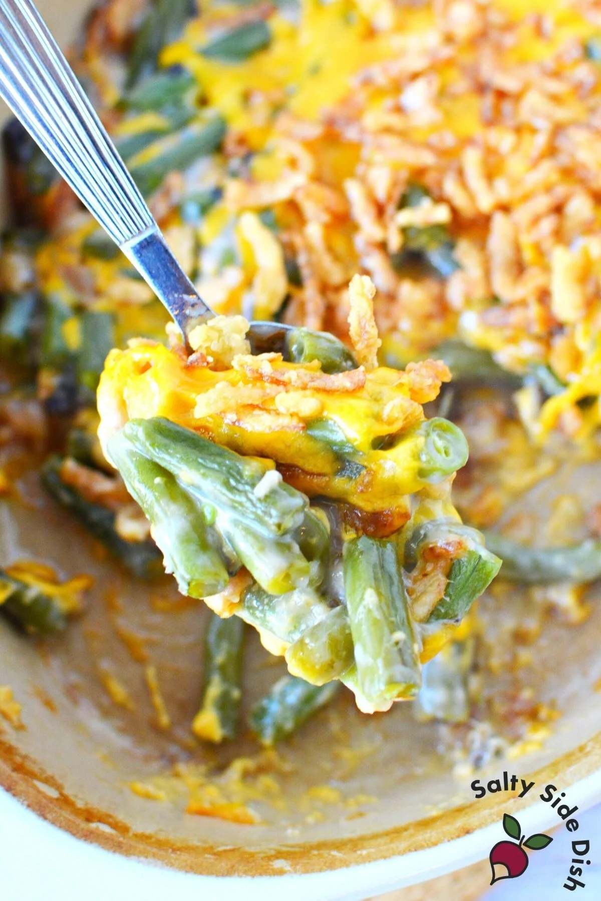 fresh green bean casserole on a spoon.
