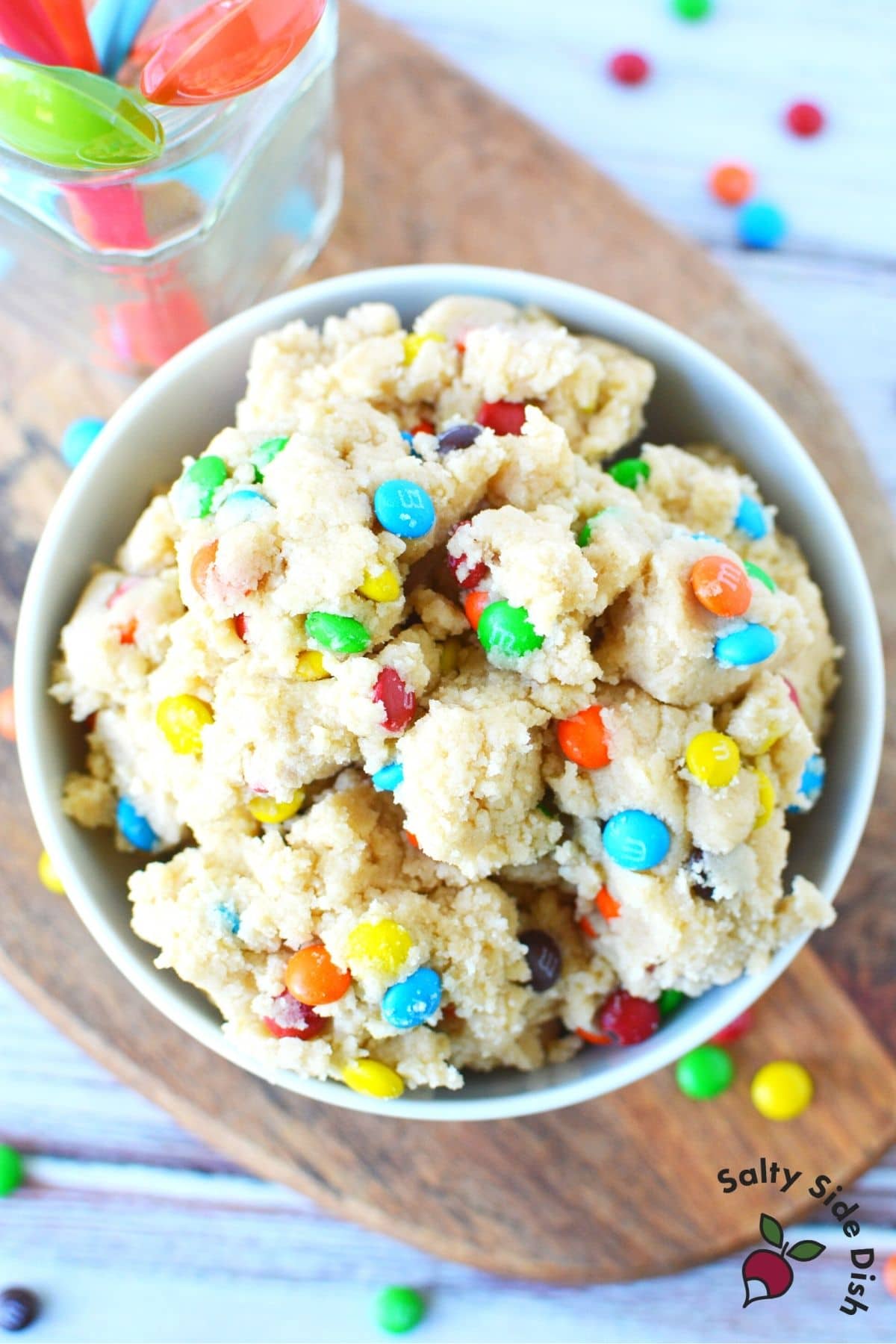 edible cookie dough in a white bowl sitting on a table