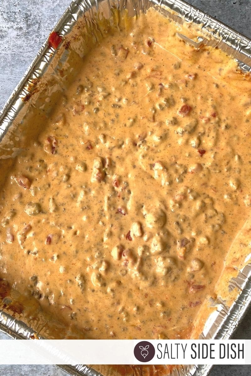 You can smoke, grill or bake this queso dip till melted with hamburger or sausage meat