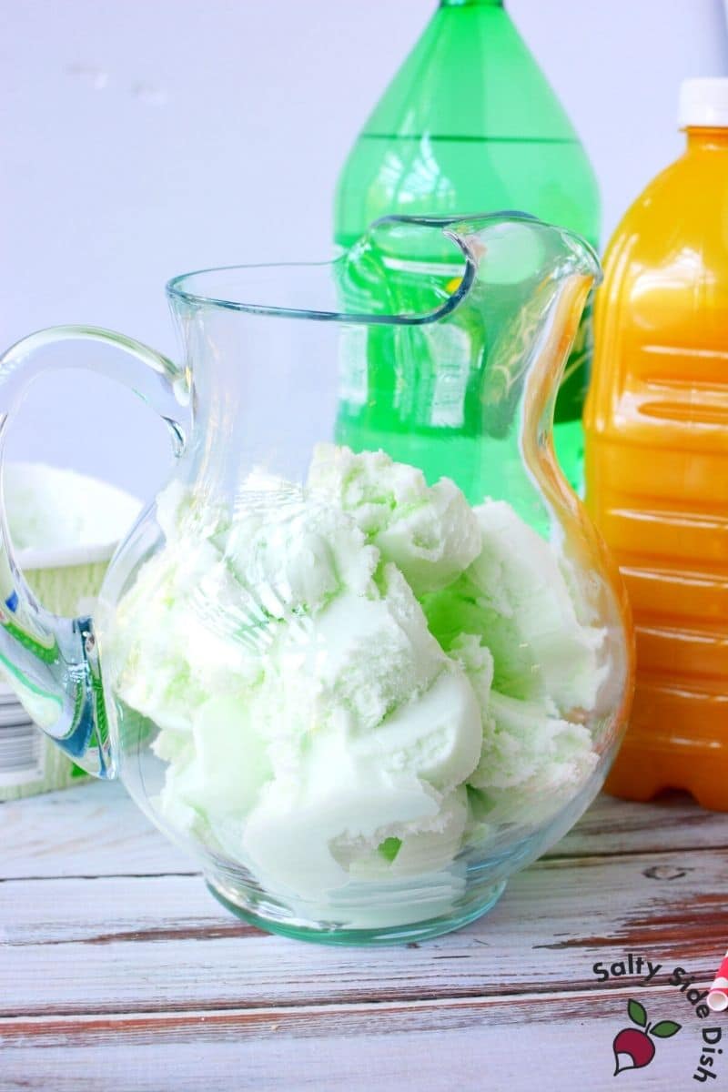 add a lot of lime sherbet to bottom of pitcher