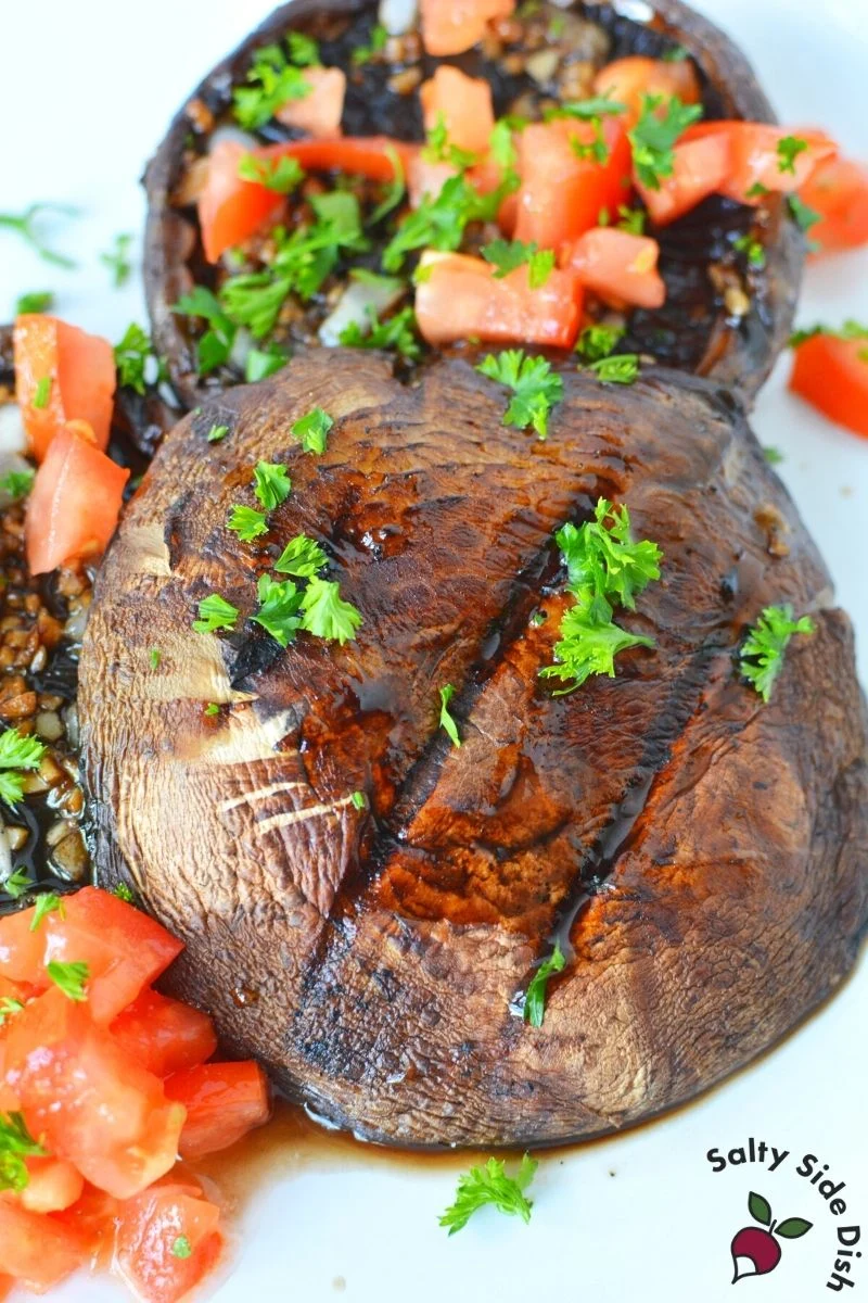 grilled portobello mushroom cap with tomatoes and fresh parsley