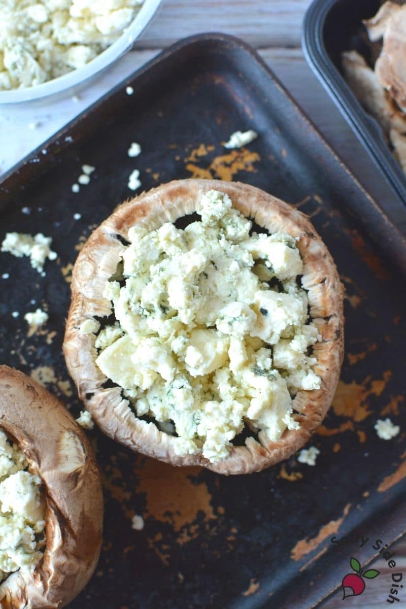 Baking Stuffed Portobello Mushrooms with crumbled blue cheese