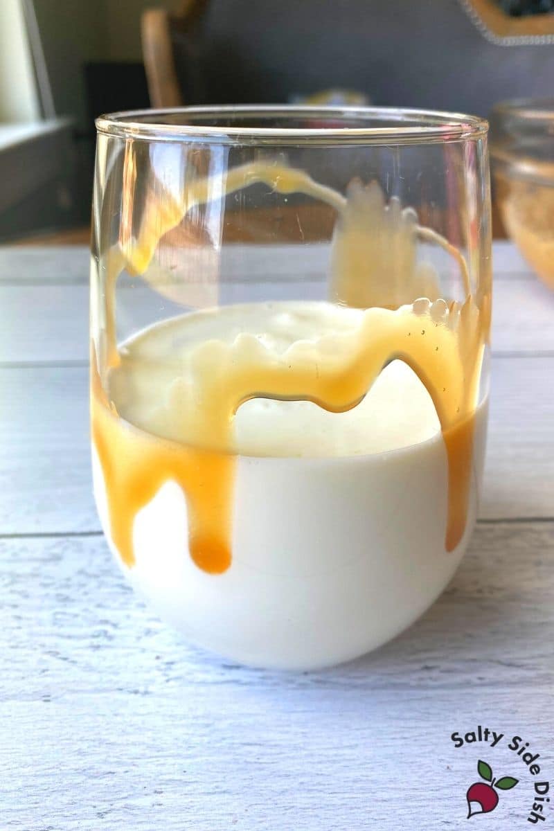 add caramel in glass, cream and milk