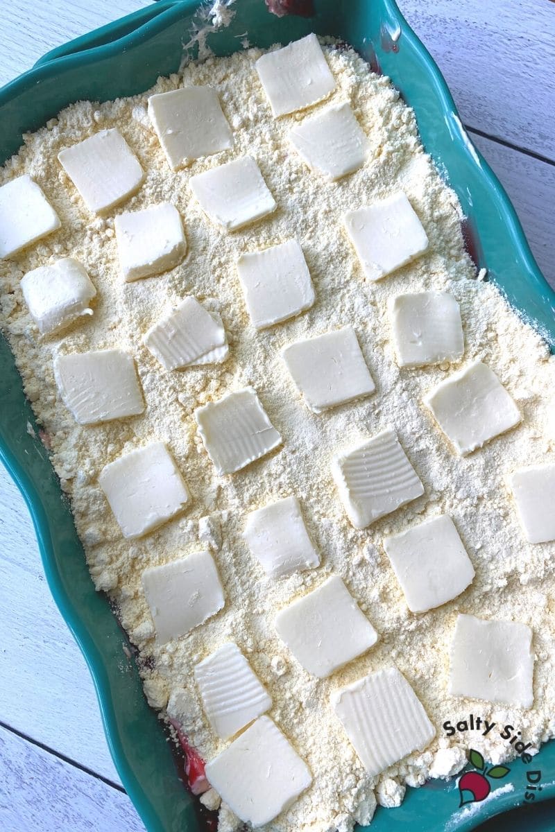 pats of butter over the top of a cake mix for a dump cake