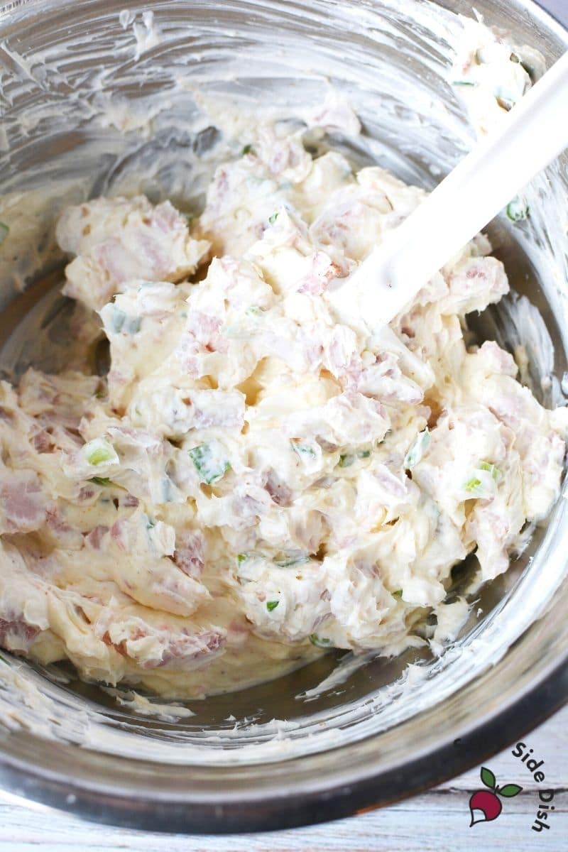 diced ham and cream cheese mixed into a bowl