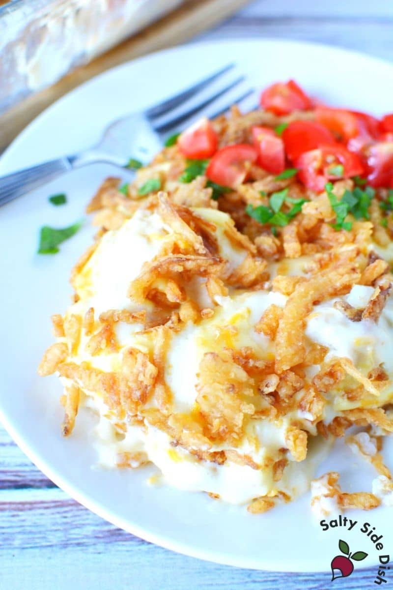 completely filling tater tot casserole with a load of potatoes and cream of chicken soup, traditional classic casserole
