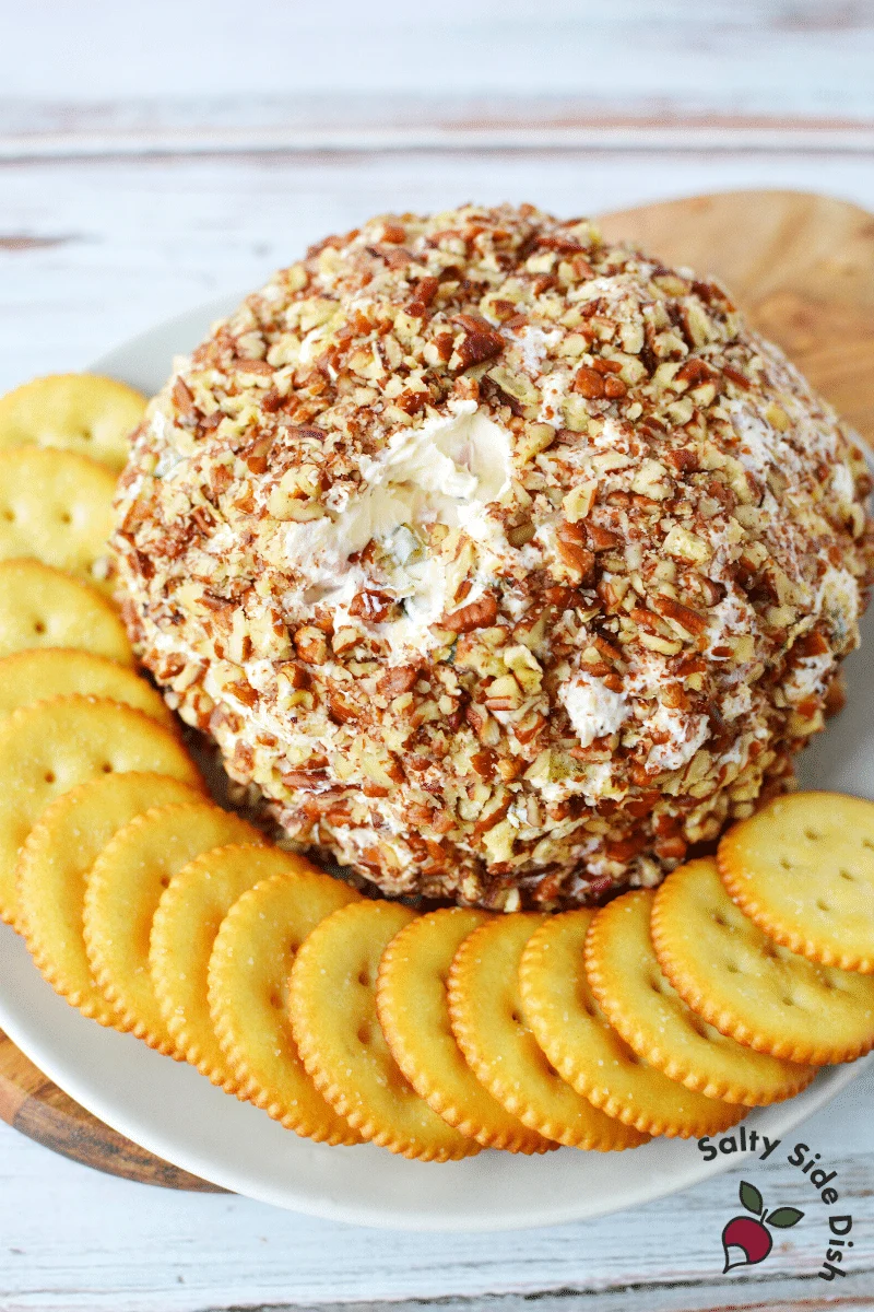 Pecan covered cream cheese ball with crackers