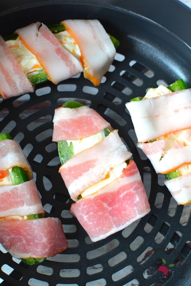 wrap jalapenos with half cut bacon
