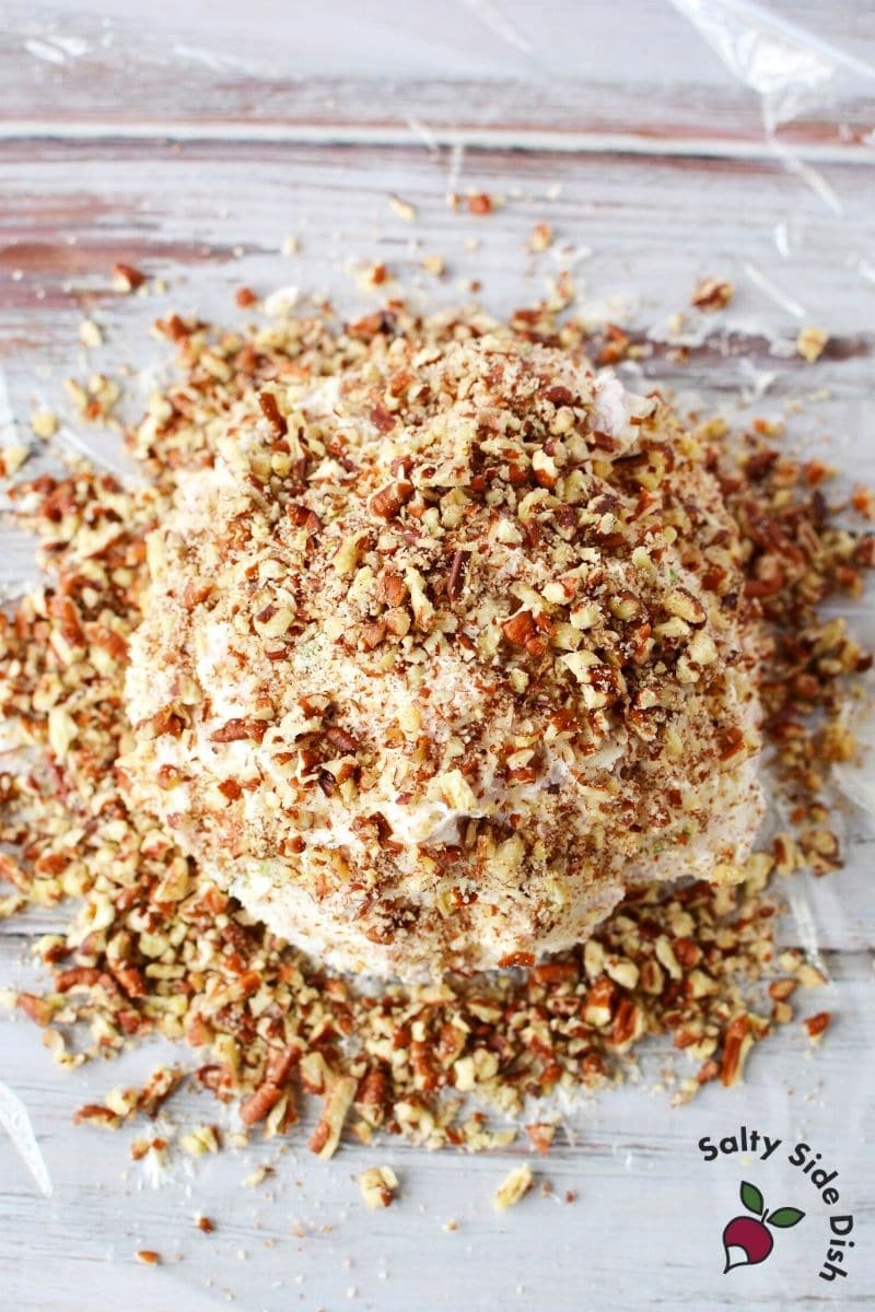 bits of pecan pieces all over cream cheese