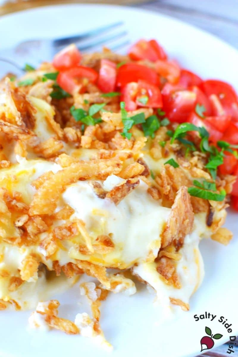 top tater tot casserole with tomatoes and parsley for color