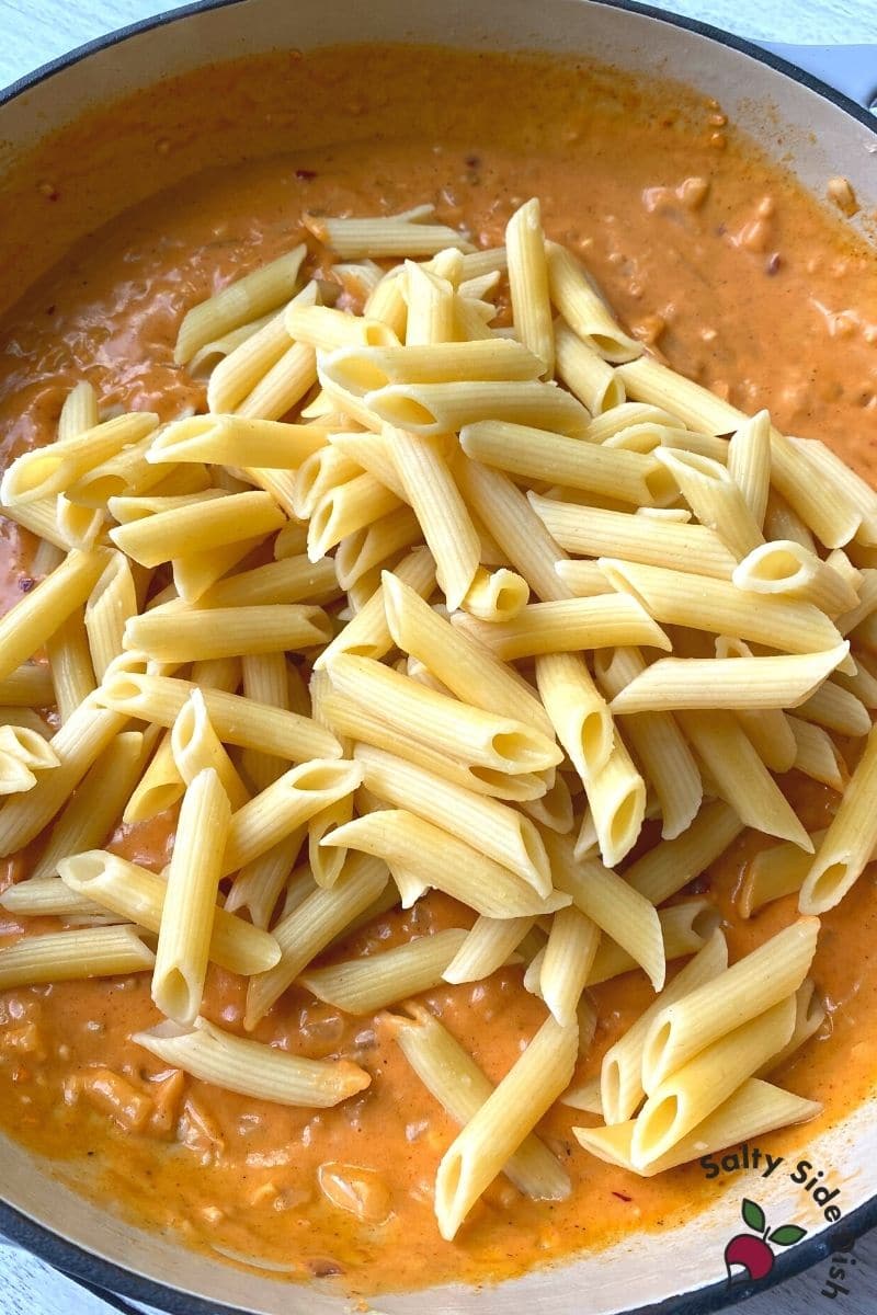 add boiled penne pasta to dish