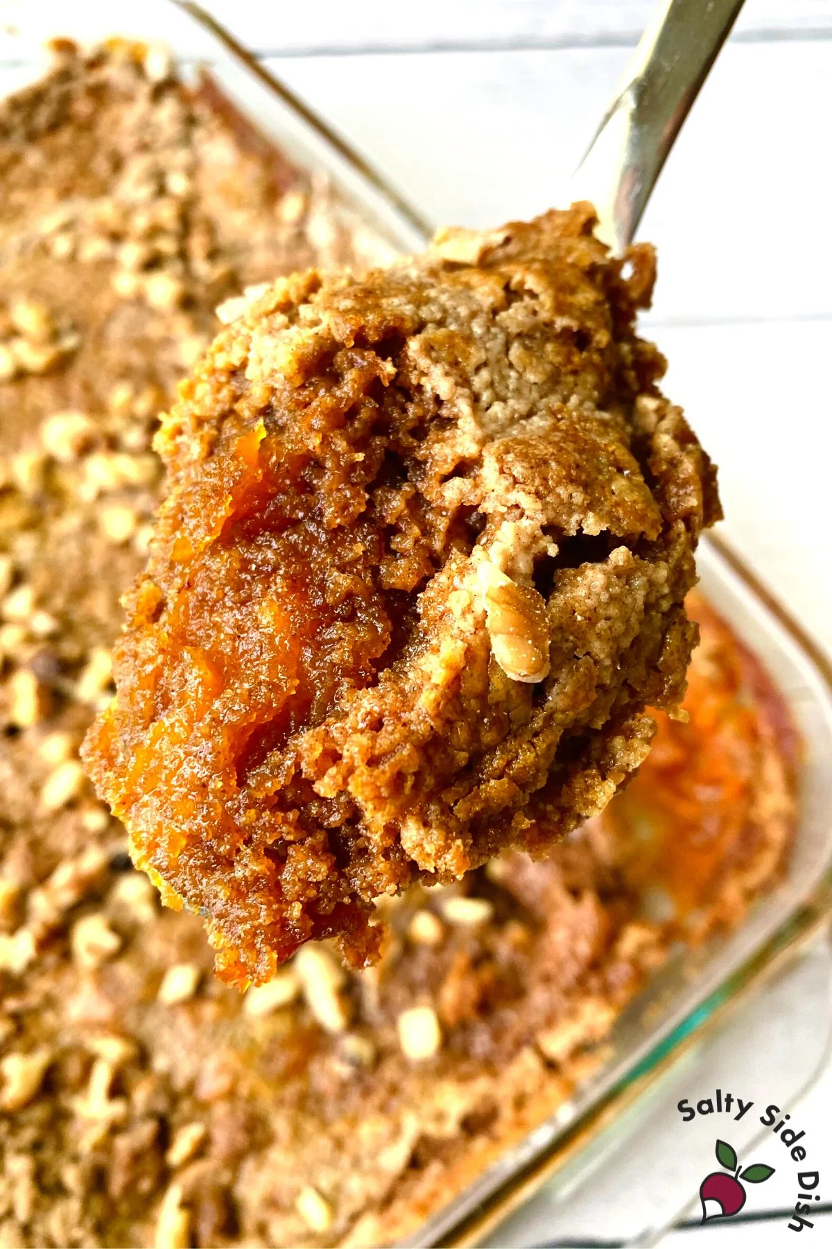 Pumpkin Pie Dump cake being scooped out to serve