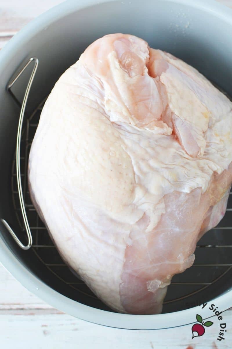 place partially thawed turkey breast into ninja foodi