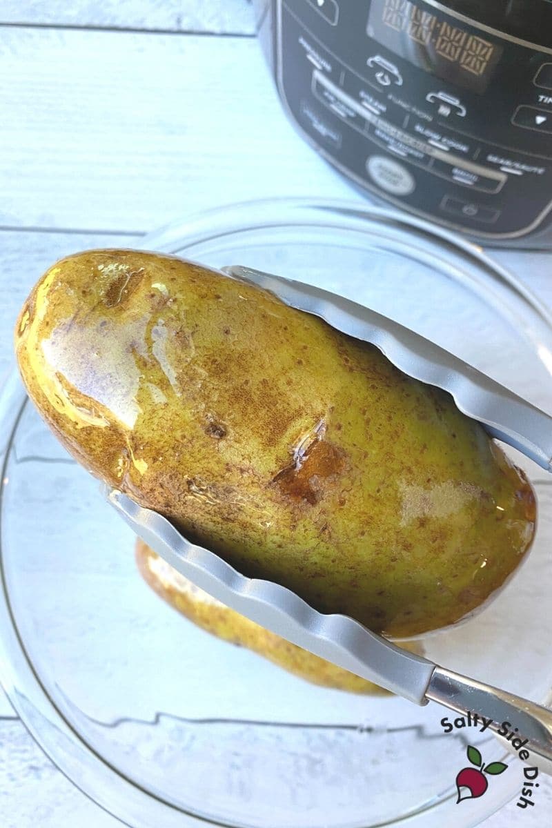 Baked Potatoes in Ninja Foodi are easy - for crispy skins add olive oil
