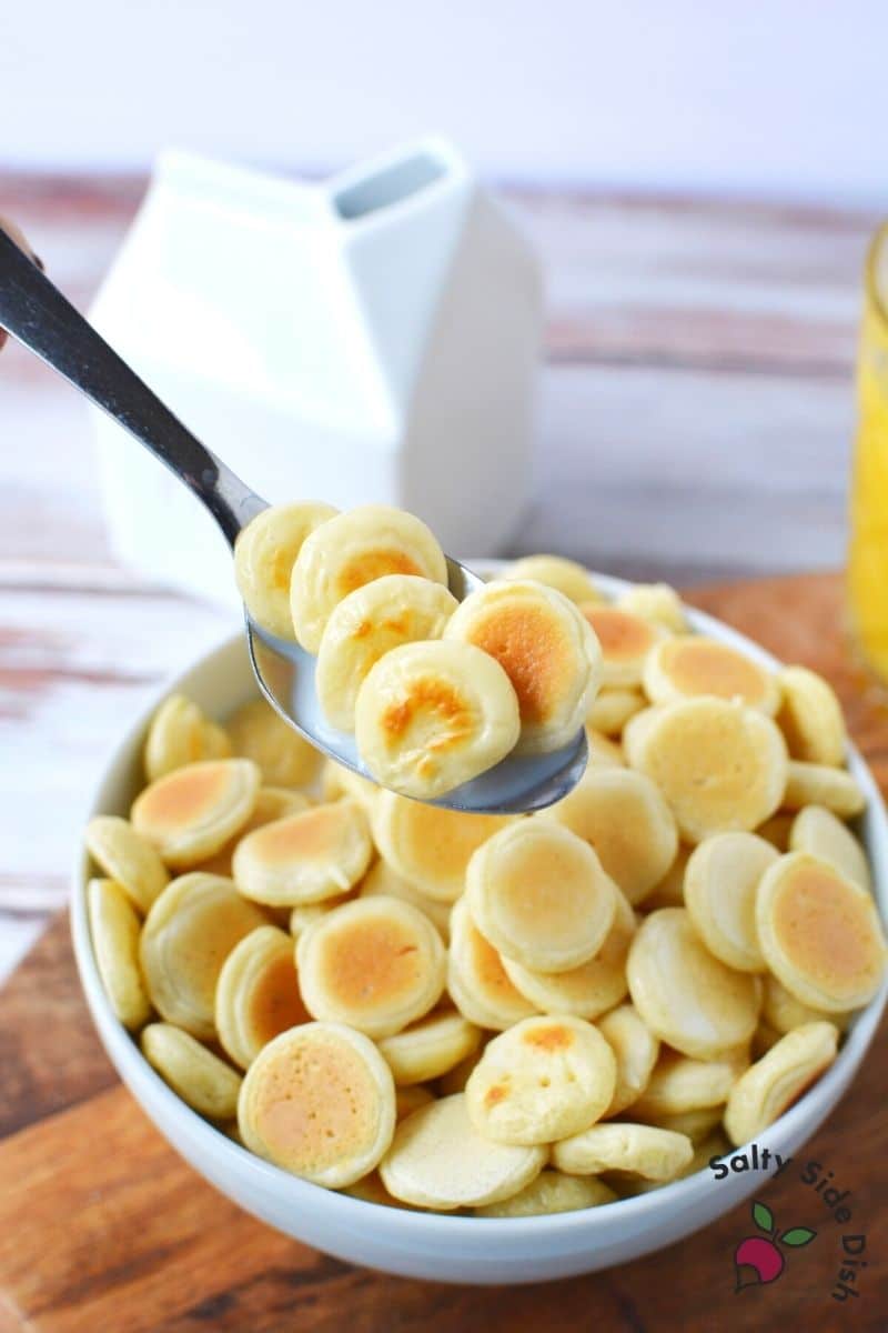 mini pancakes served in a bowl with milk