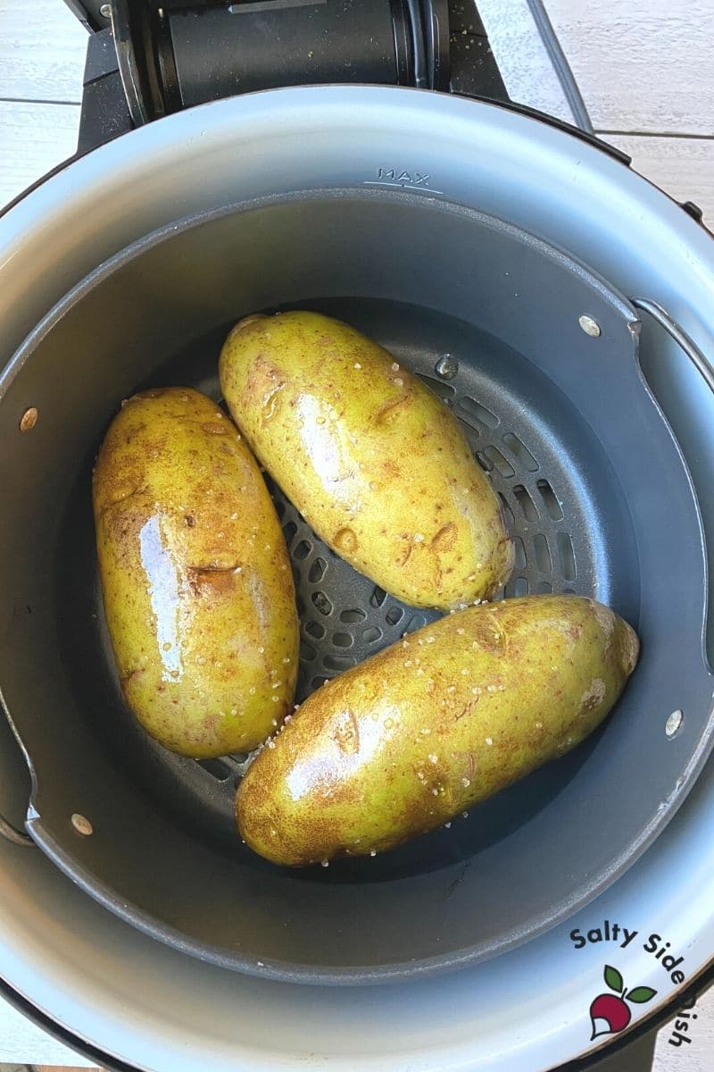 add potatoes into air fryer air crisp basket - Ninja Foodi baked potatoes are so easy to make and way better than in the oven.