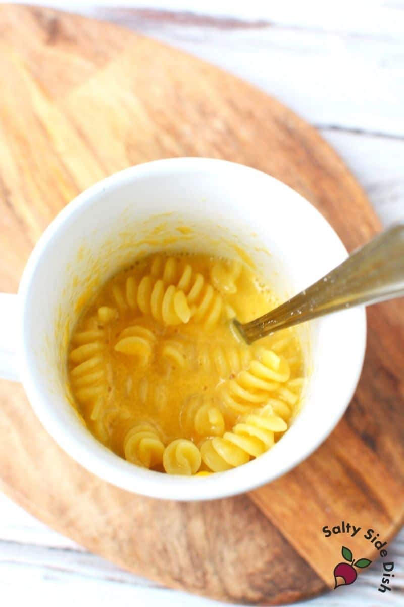 Melted cheddar and milk into a mug or cup for tiktoks famous mac n cheese in a mug