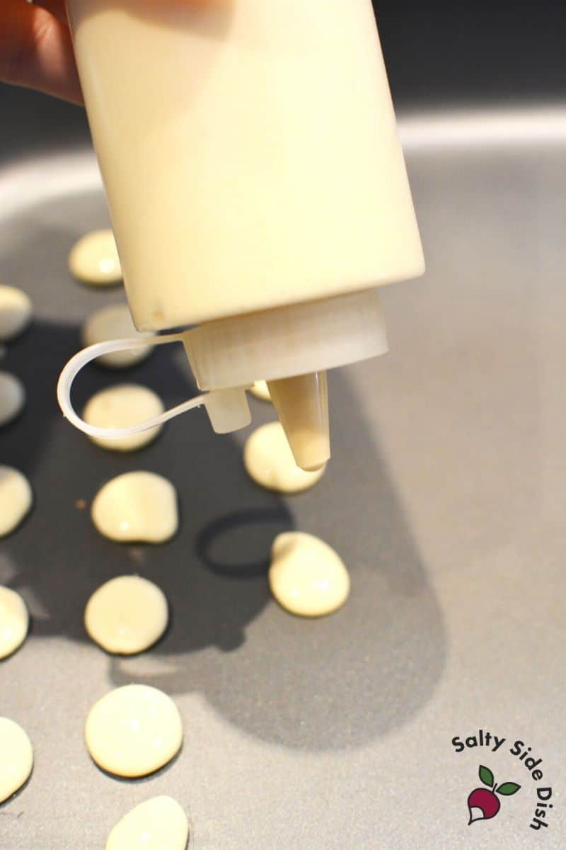 use a squeeze condiment bottle for the perfect pancake size