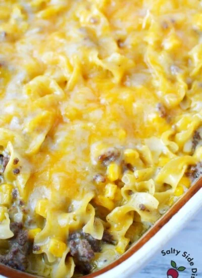 Easy hamburger casserole with cheddar cheese and egg noodles sitting in large baking dish ready to be served