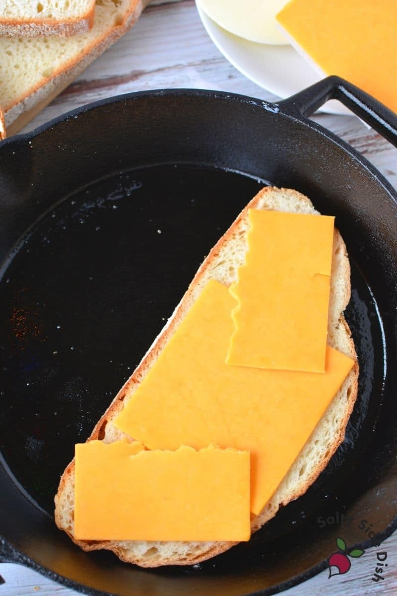 cheddar cheese slices laid on bread
