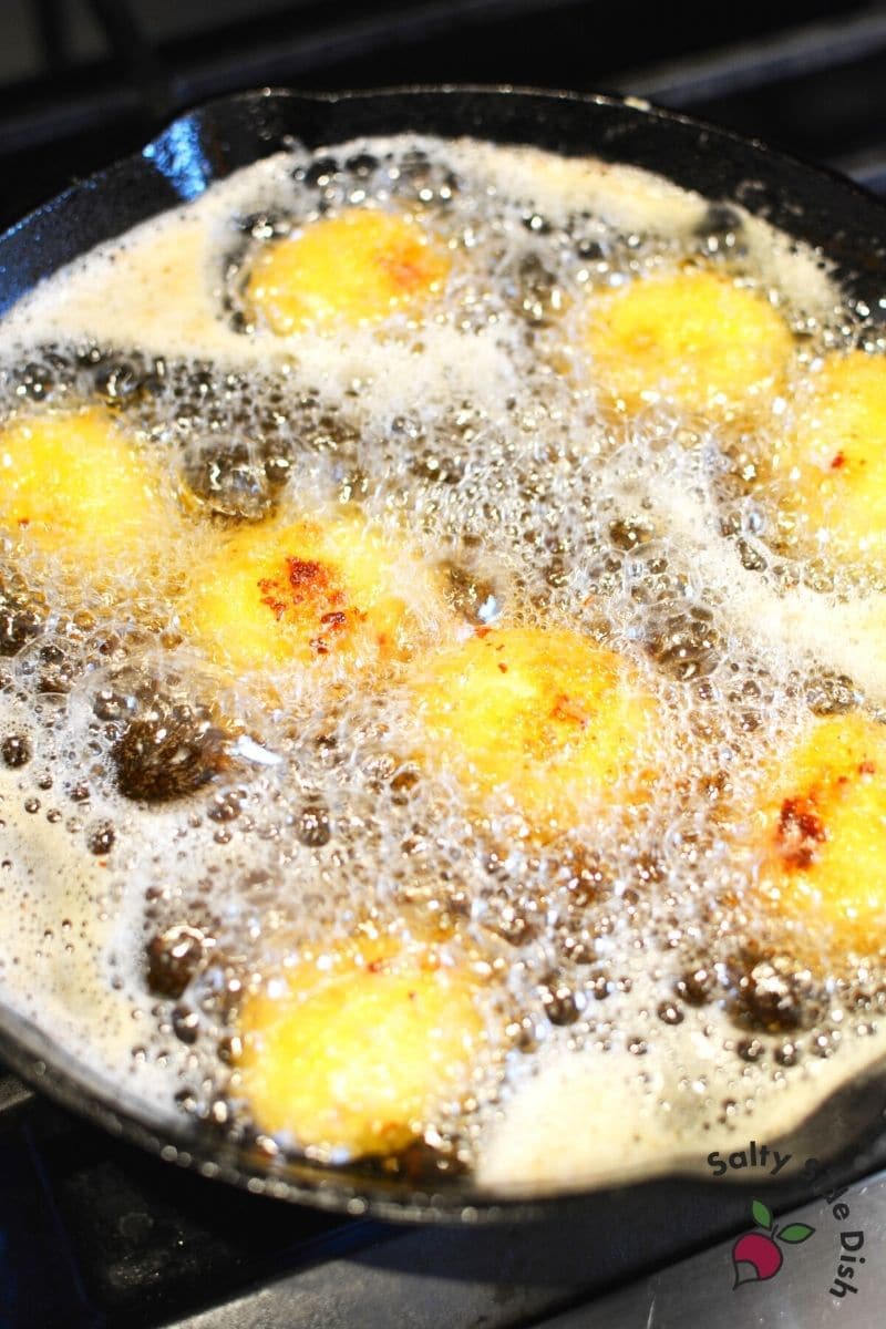 Fry deviled eggs in hot oil