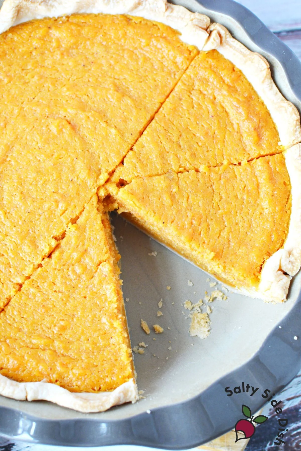 one piece cut out of sweet potato pie.