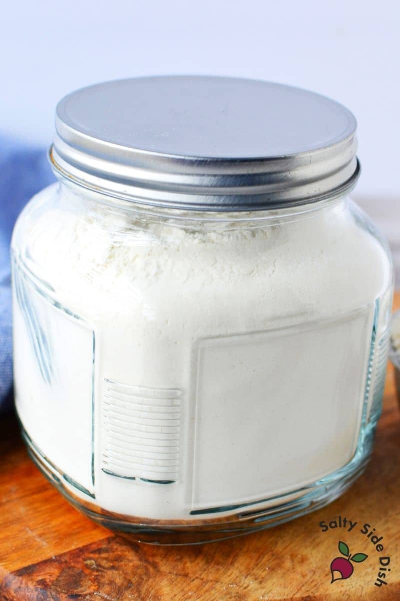 premade self rising flour sitting in a mason jar with air tight lid for storage