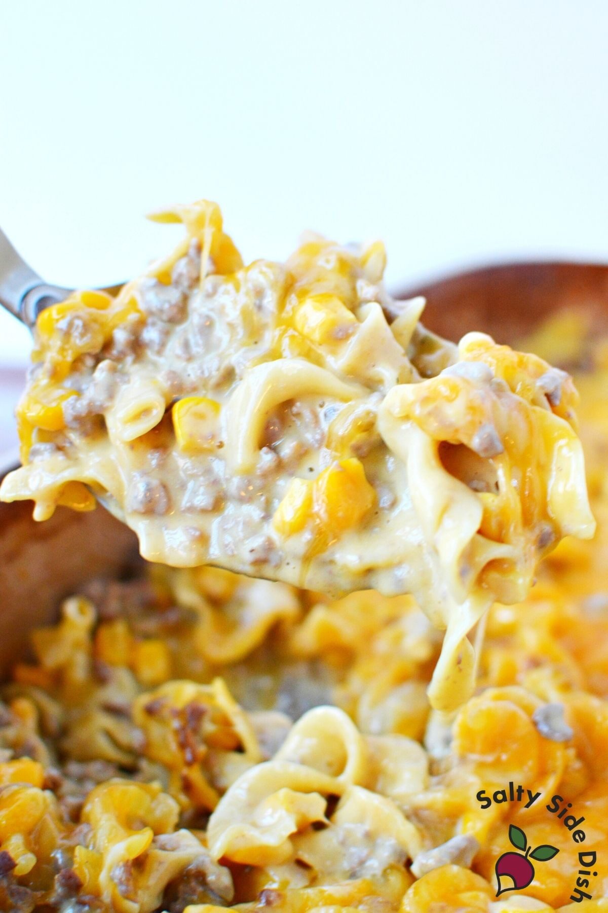 large scoop of velveeta beef casserole.