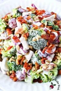 broccoli and grape salad in a white bowl.
