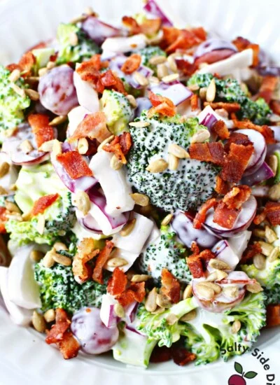 broccoli and grape salad in a white bowl.