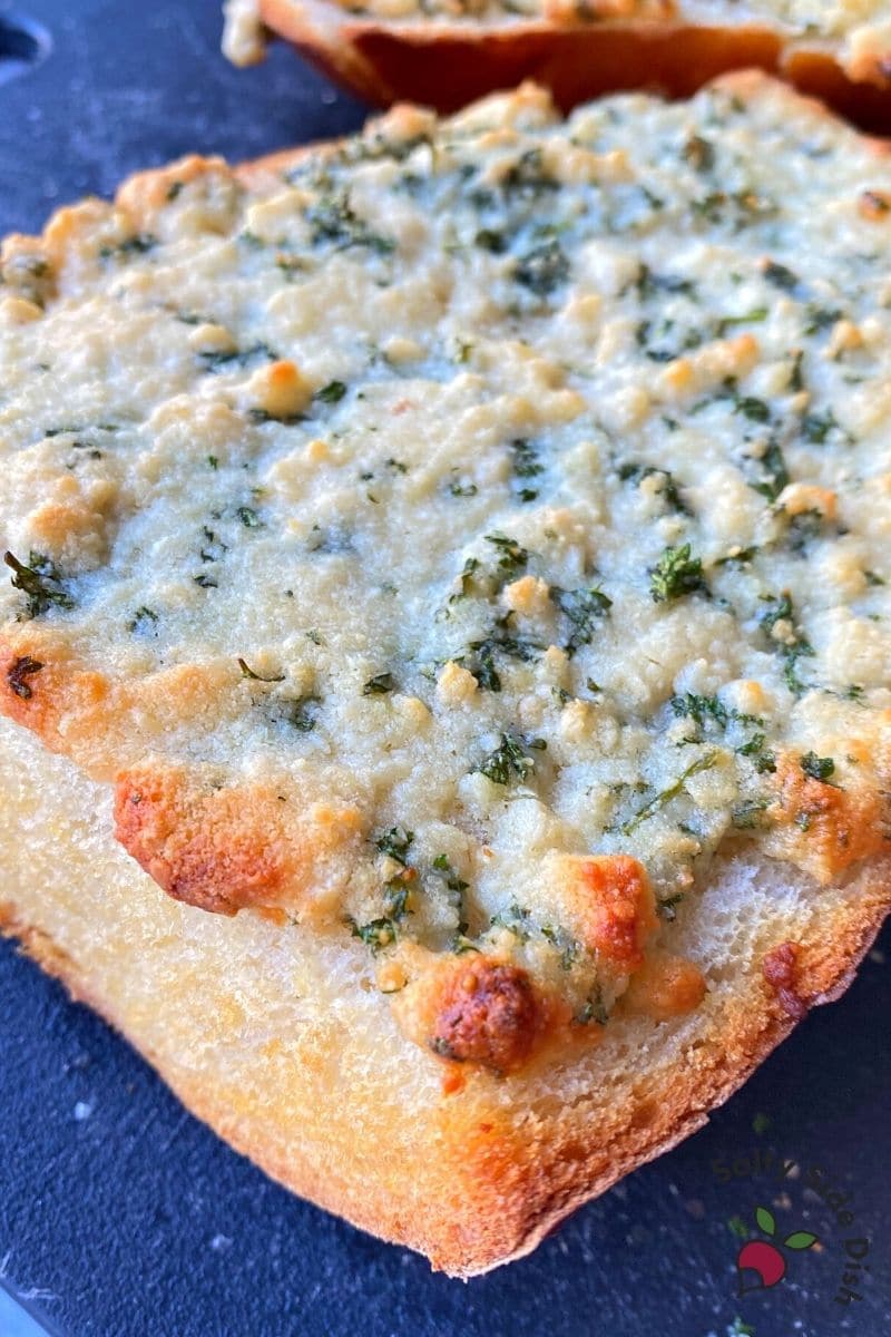 crust parmesan and garlic cheesy bread in the oven