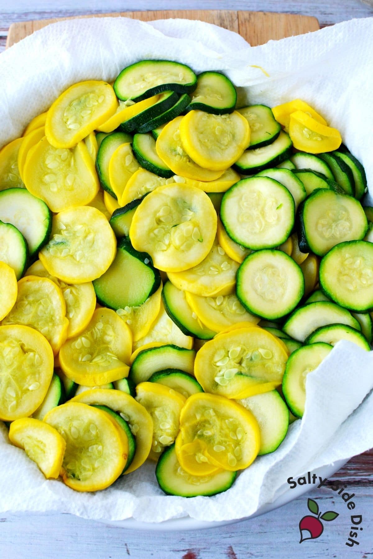 yellow squash and zucchini rounds microwaved and sitting in a bowl