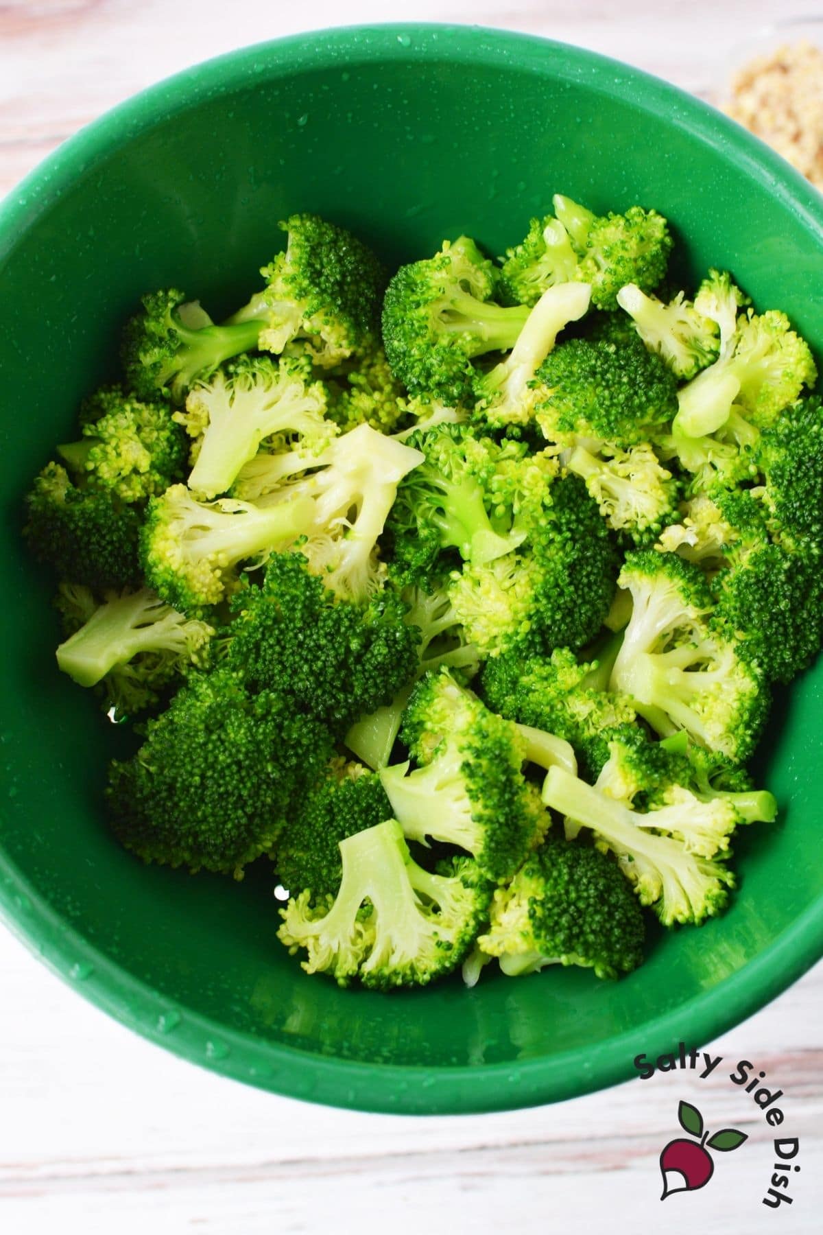 al dente broccoli flash boiled and placed in a bowl