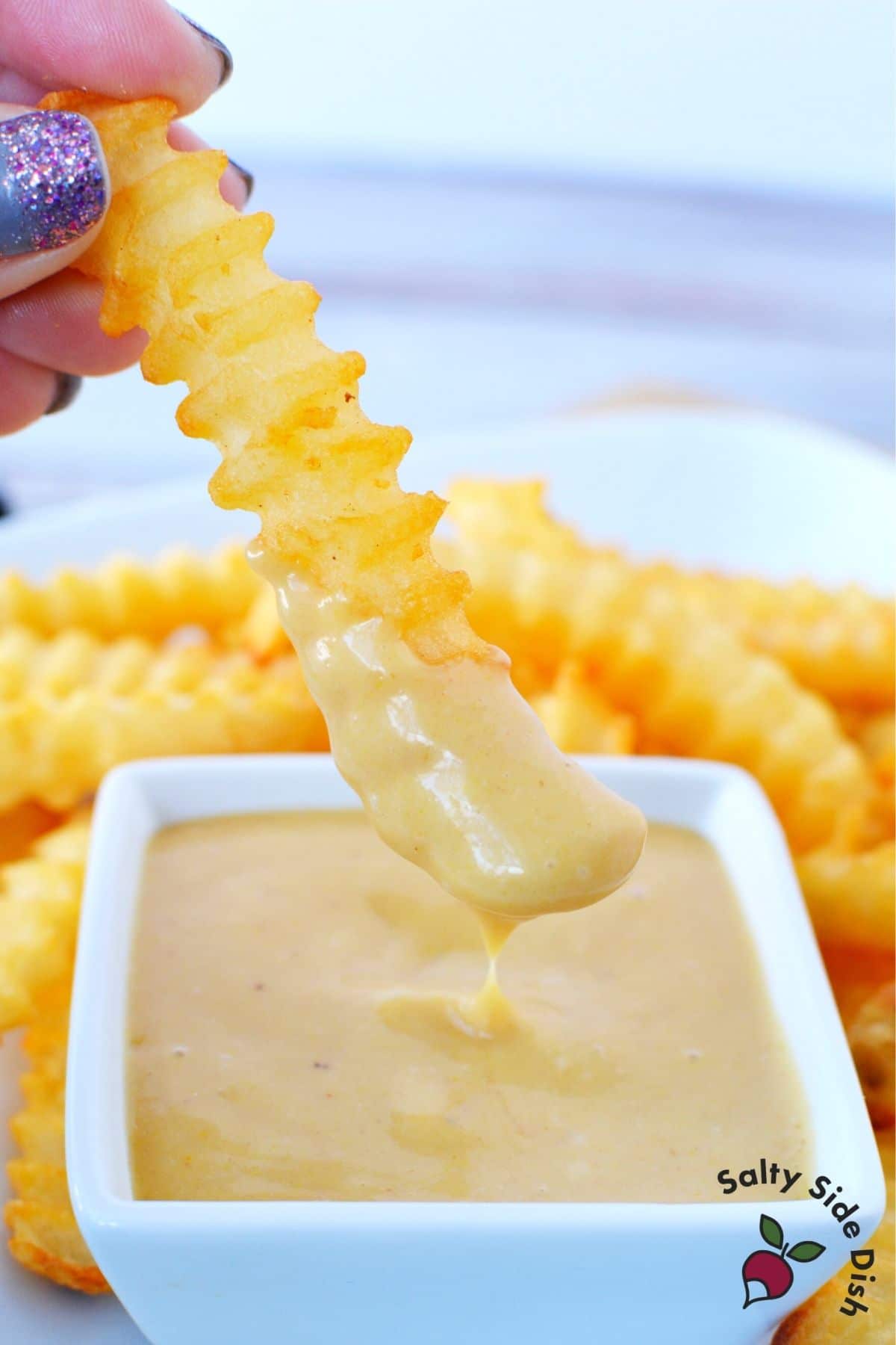 dipping fry into sauce