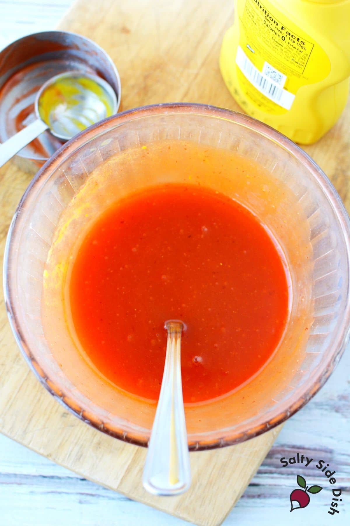 sauce in a bowl with a spoon