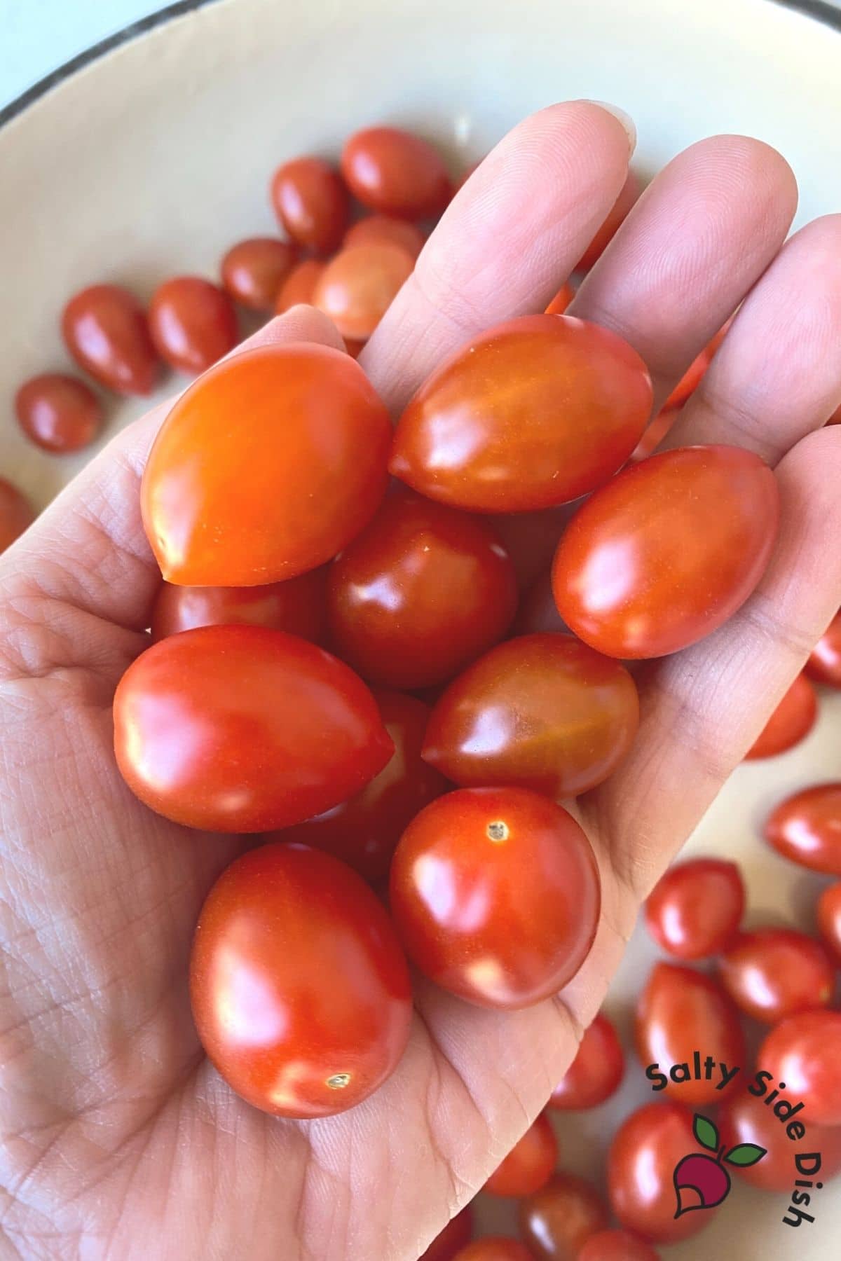 grape tomatoes in a hand