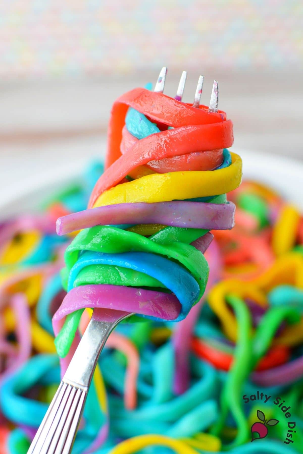colored pasta around a fork