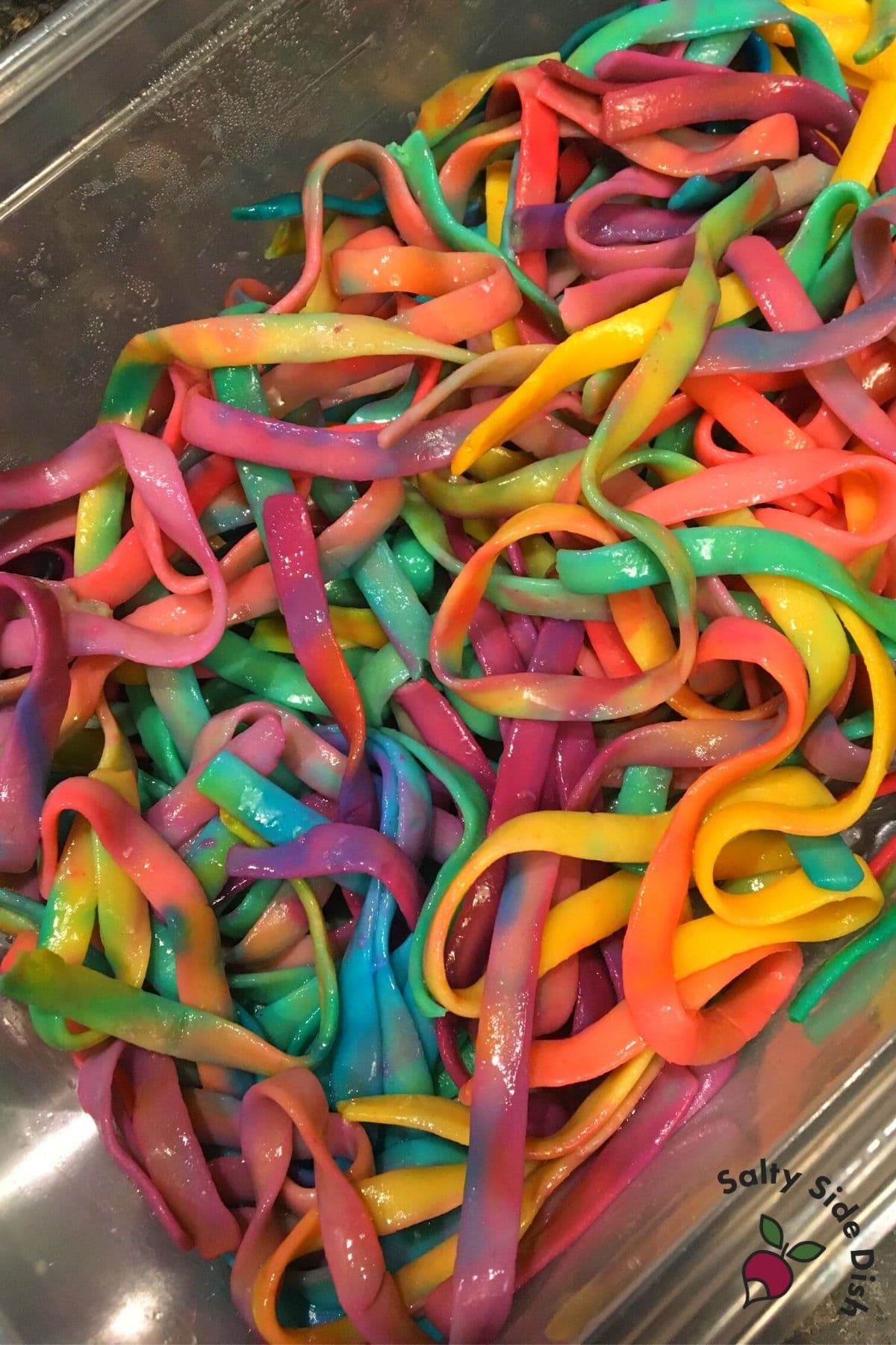 tied dyed pasta mixed up in a bowl (edible)