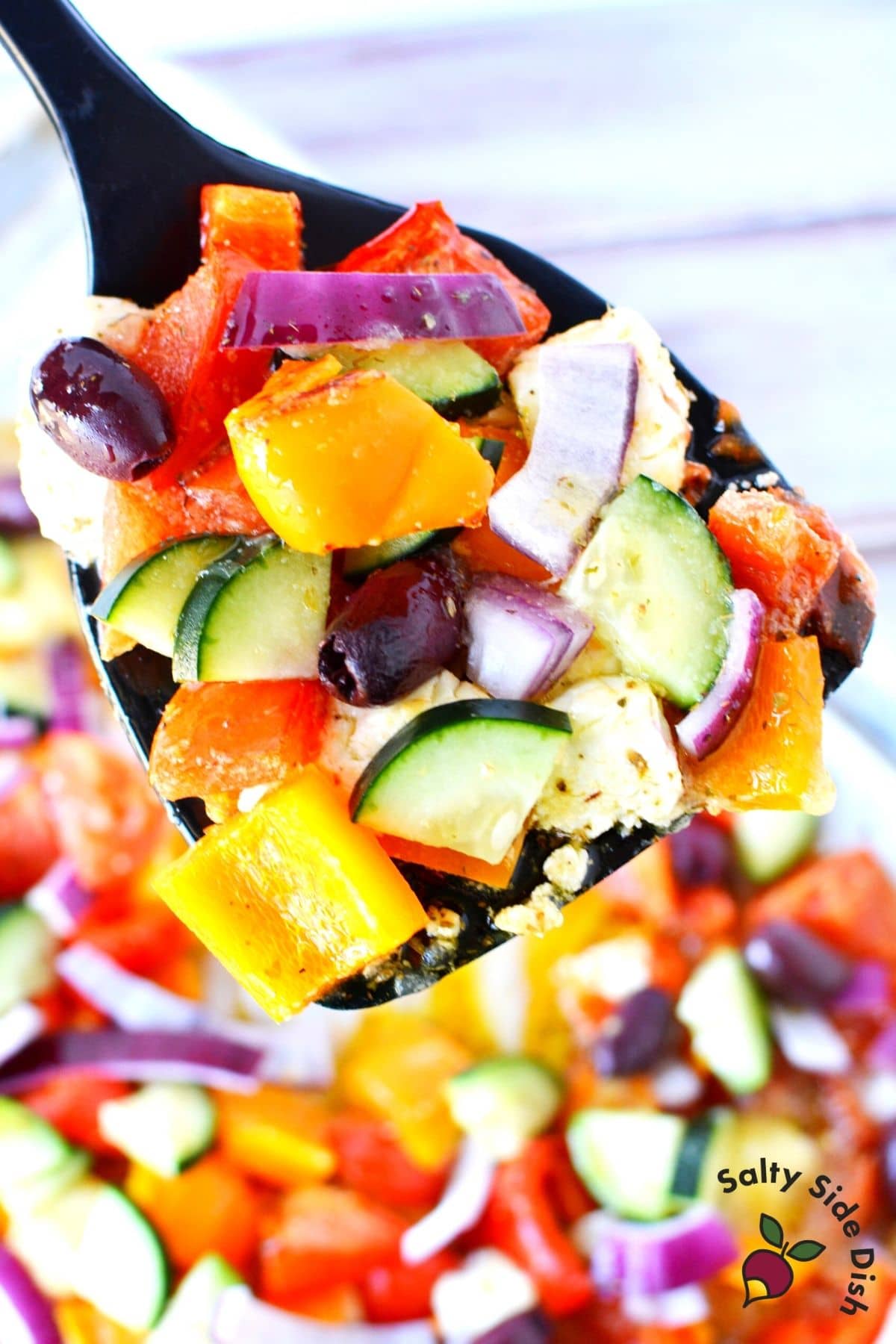 baked greek salad on a spatula