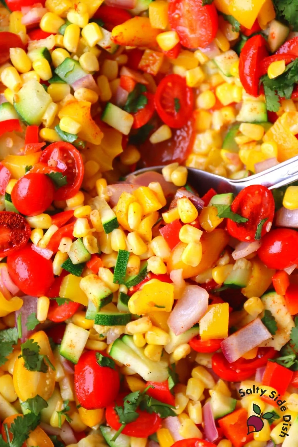 scoop of corn succotash in pot