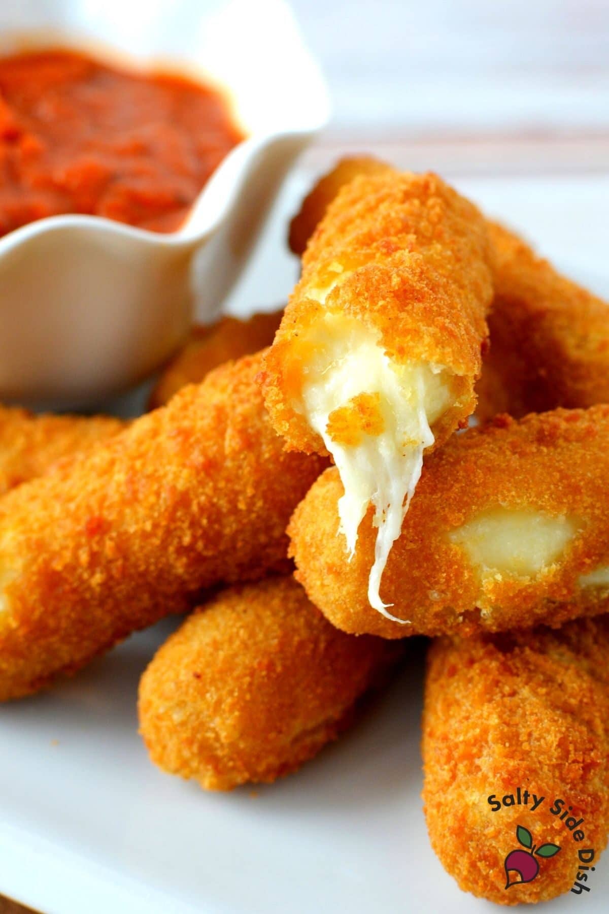 cheese coming out of a mozzarella stick