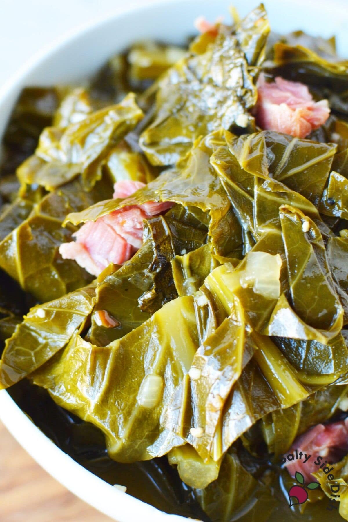 slow cooked collard greens in a bowl with ham