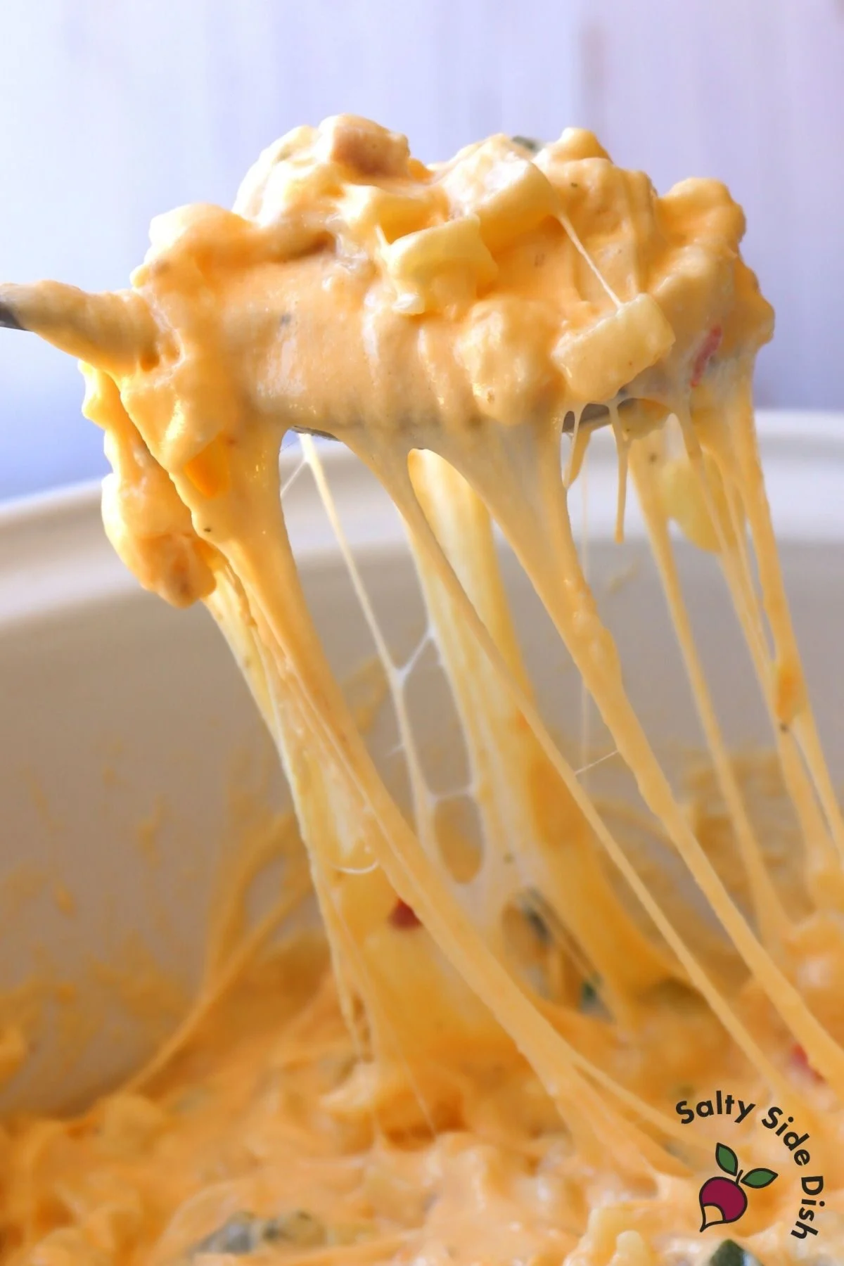 chees y potatoes on a spoon