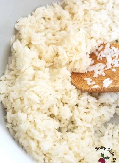 rice in a ninja foodi inner pot and wooden spoon