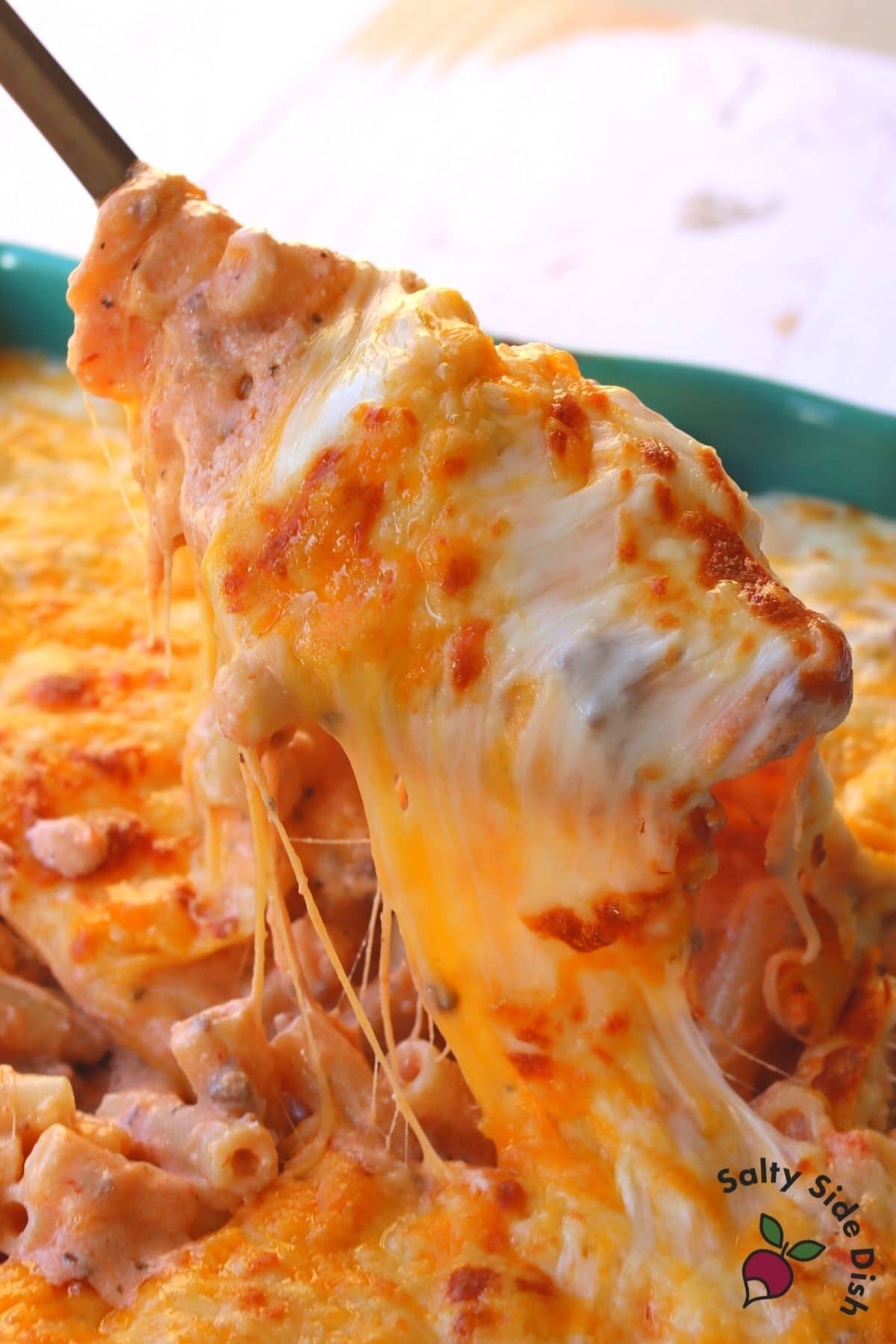 baked ziti with ricotta in a large spoon