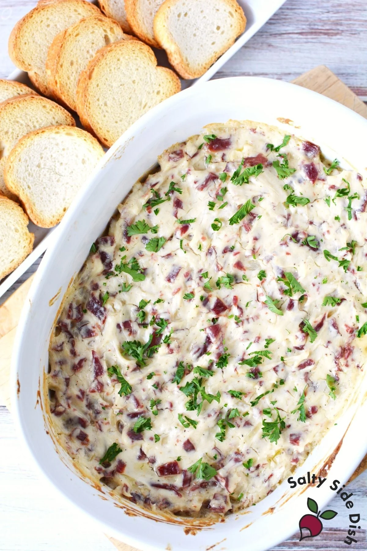 beef dip in a white serving dish.