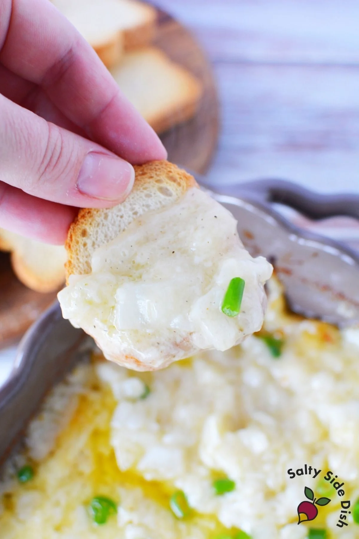 hot melted onion dip with cheese on a slice of bread