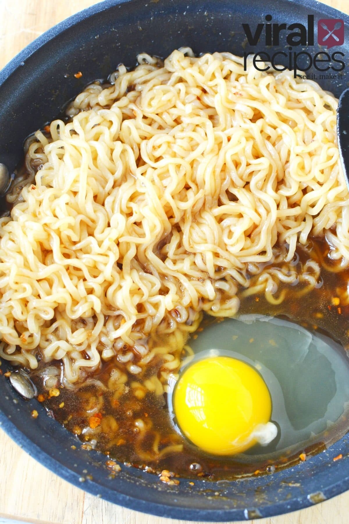ramen noodles in a pan with an egg