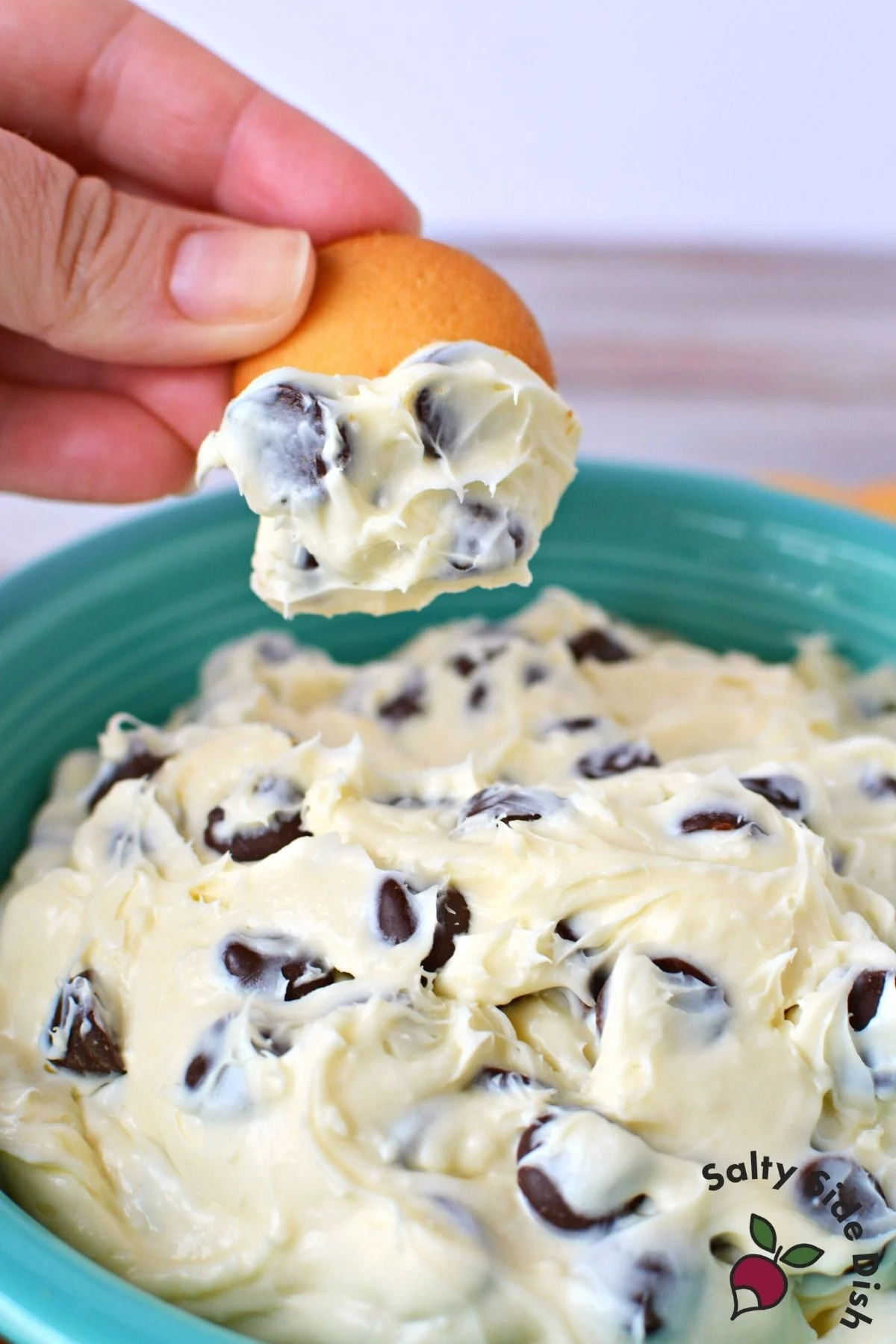 chocolate chip cheesecake dip with a vanilla wafer.