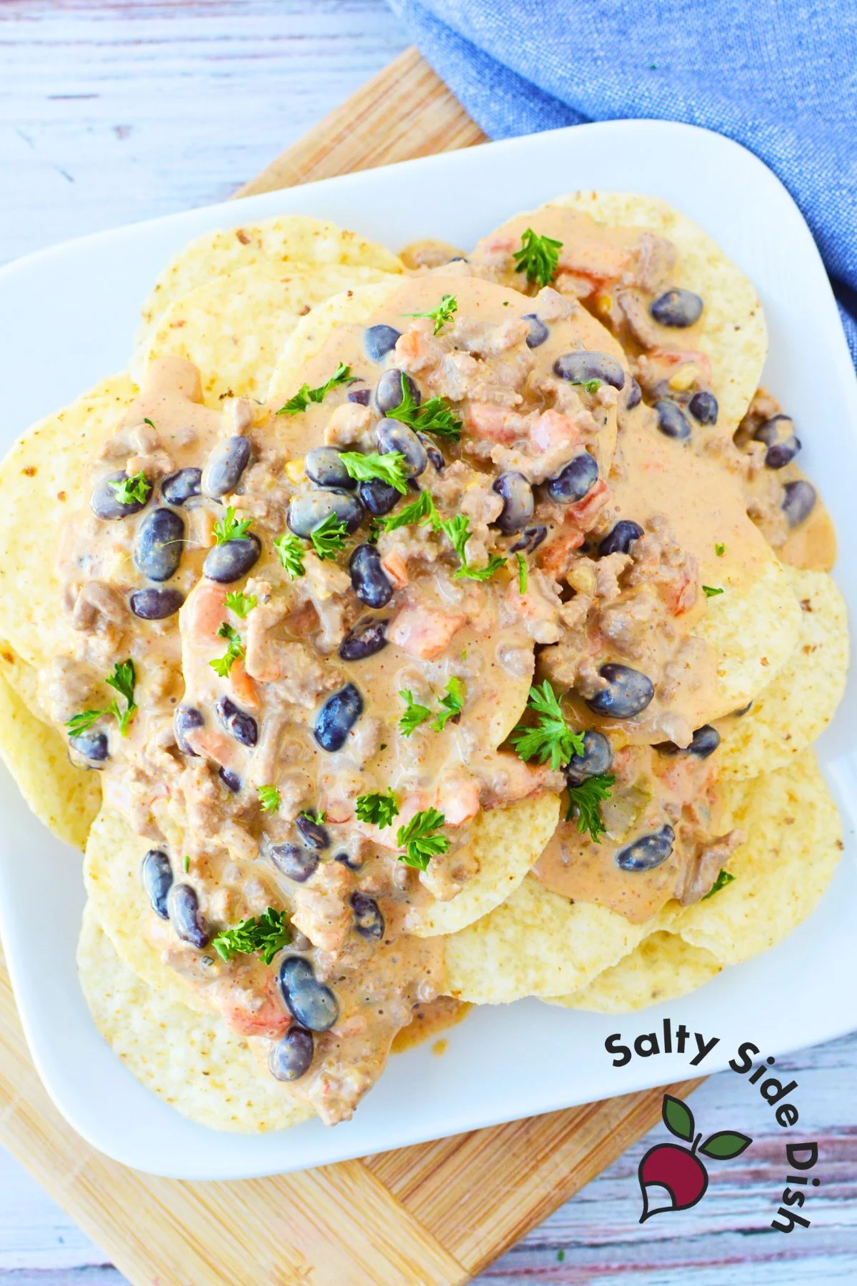 cheeseburger dip over tortilla chips.